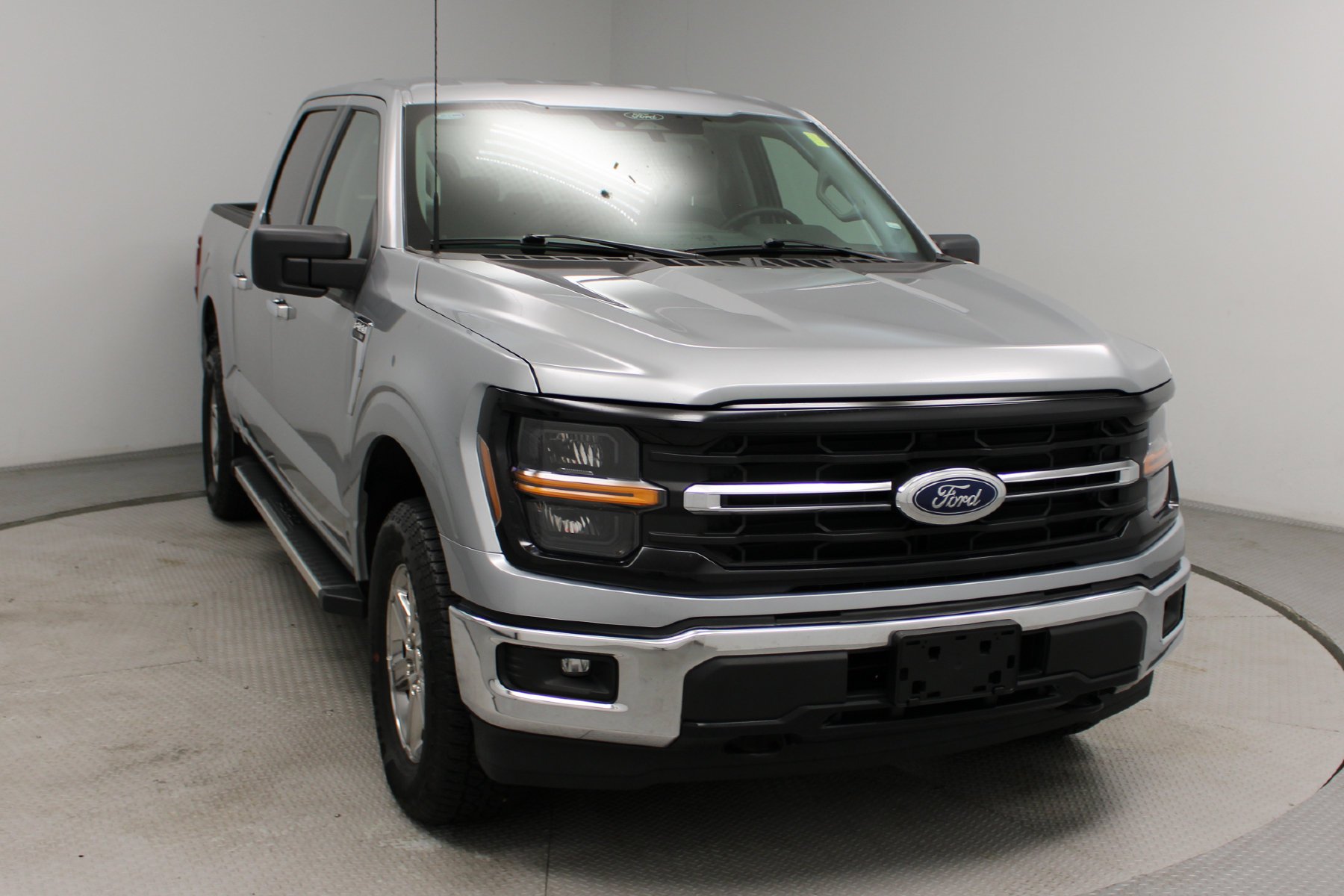 Used 2025 ICONIC SILVER METALLIC Ford XLT 4WD SuperCrew 5.5