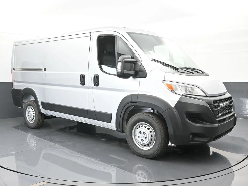 Used 2025 Bright Silver Clearcoat Metallic Ram Low Roof image 8