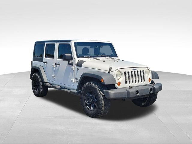 Used 2012 Jeep Wrangler Unlimited Sport with VIN 1C4BJWDG9CL232356 for sale in Fenton, MI