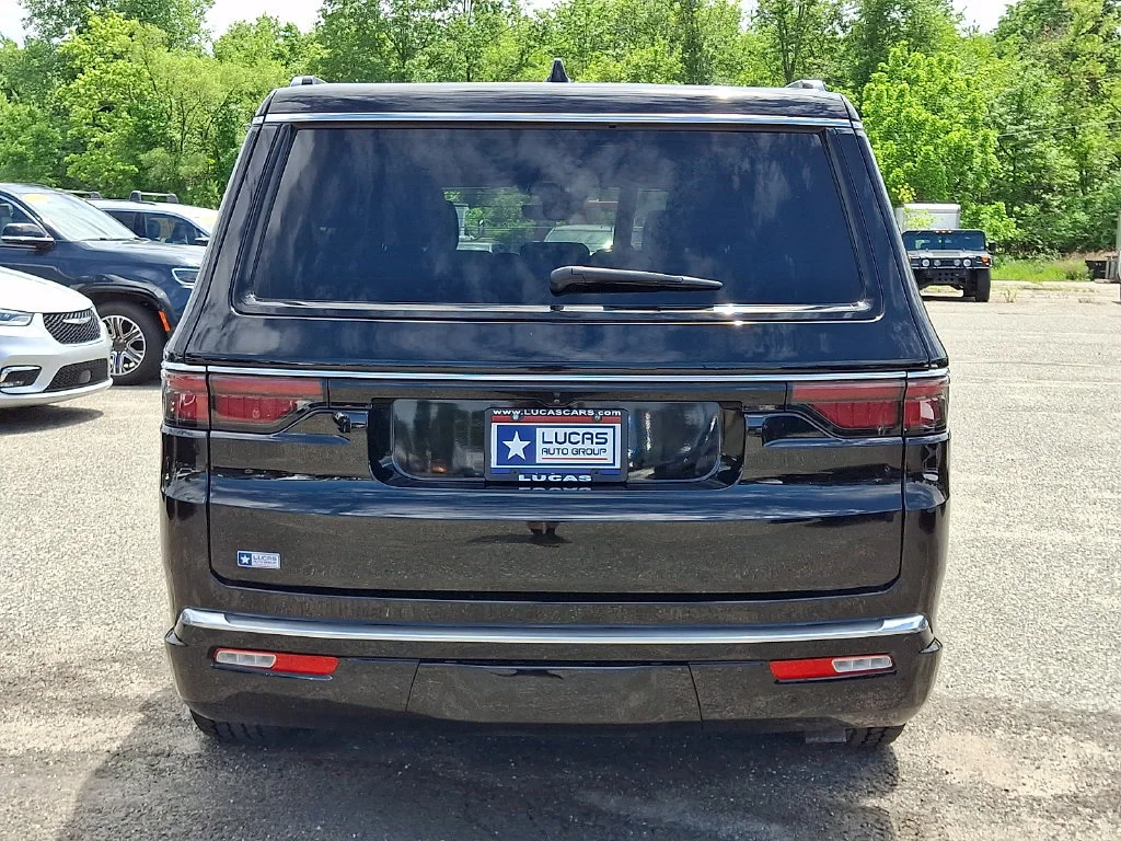Used 2023 Diamond Black Crystal Pearlcoat Jeep Series III image 10