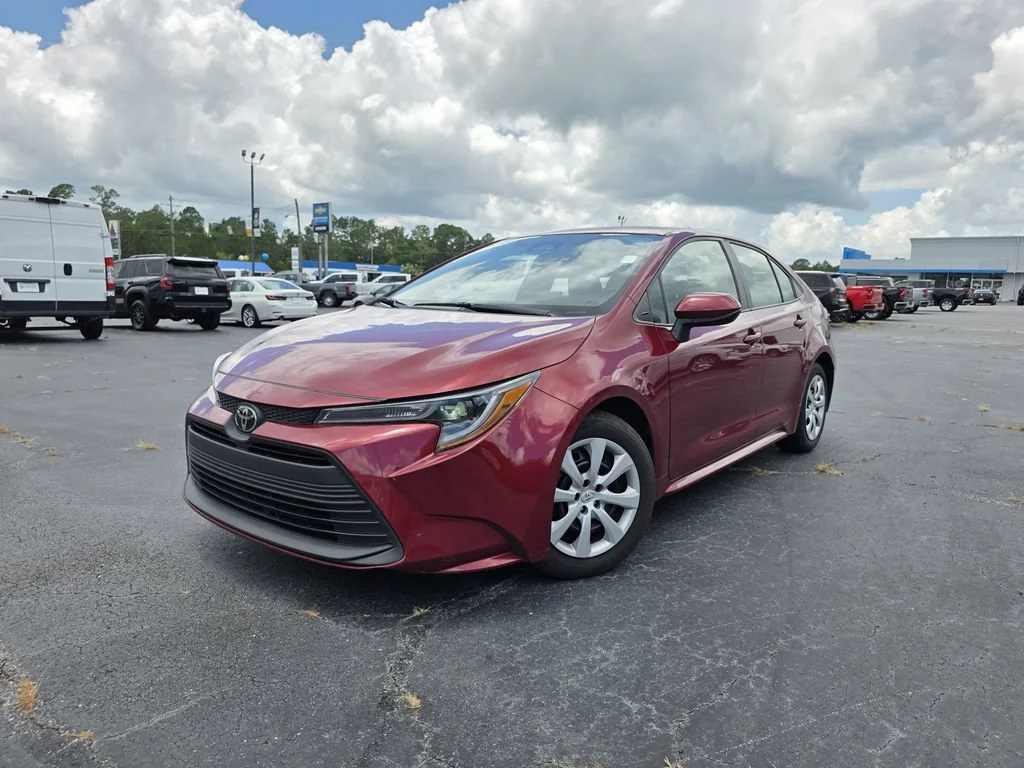 Used 2024 Red Med Toyota LE image 1