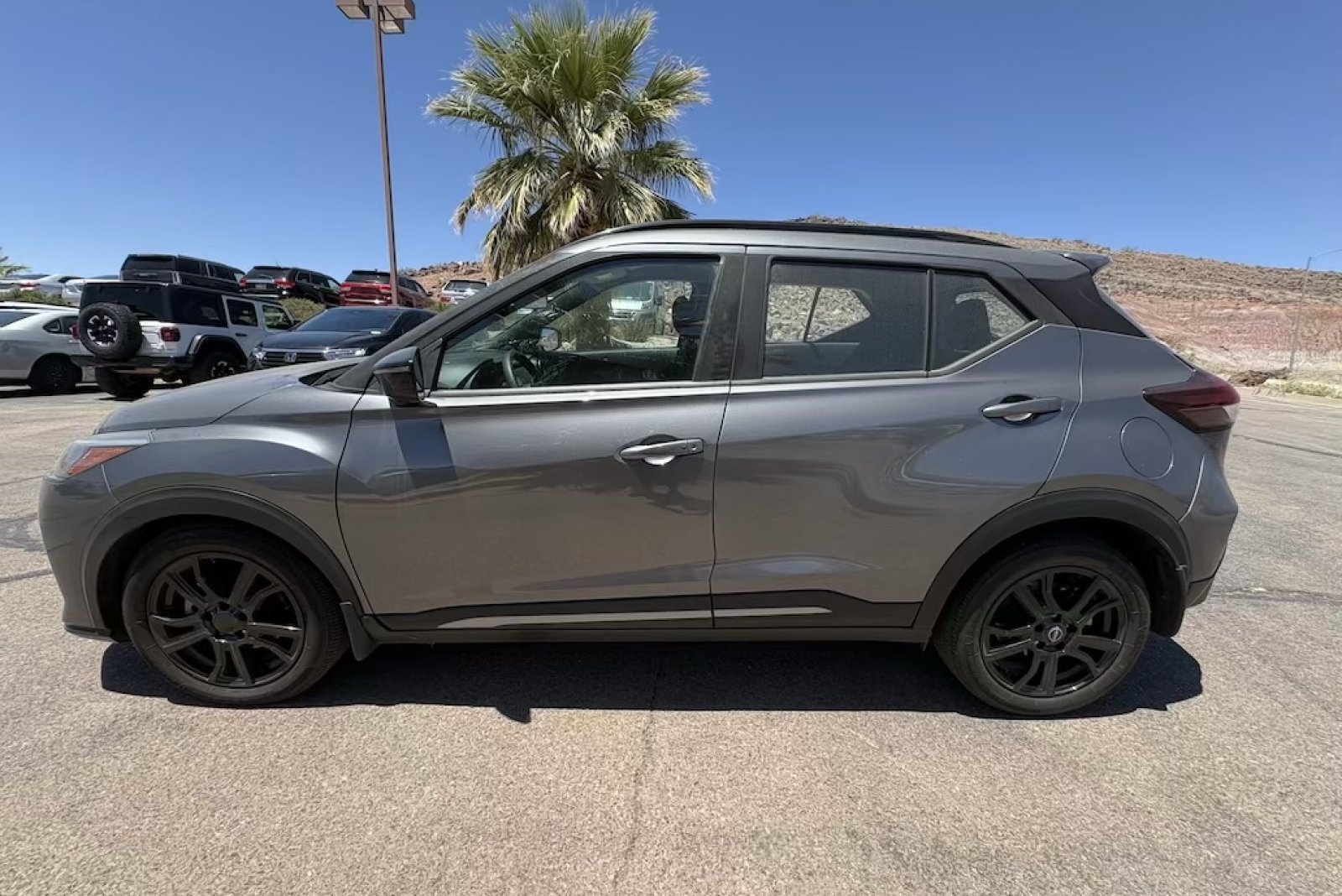 Used 2024 Gun Metallic Nissan SR image 2