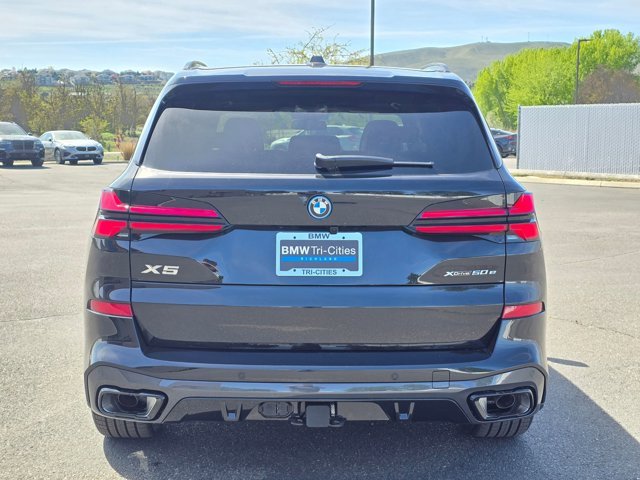 New 2026 Black Sapphire Metallic BMW xDrive50e image 37