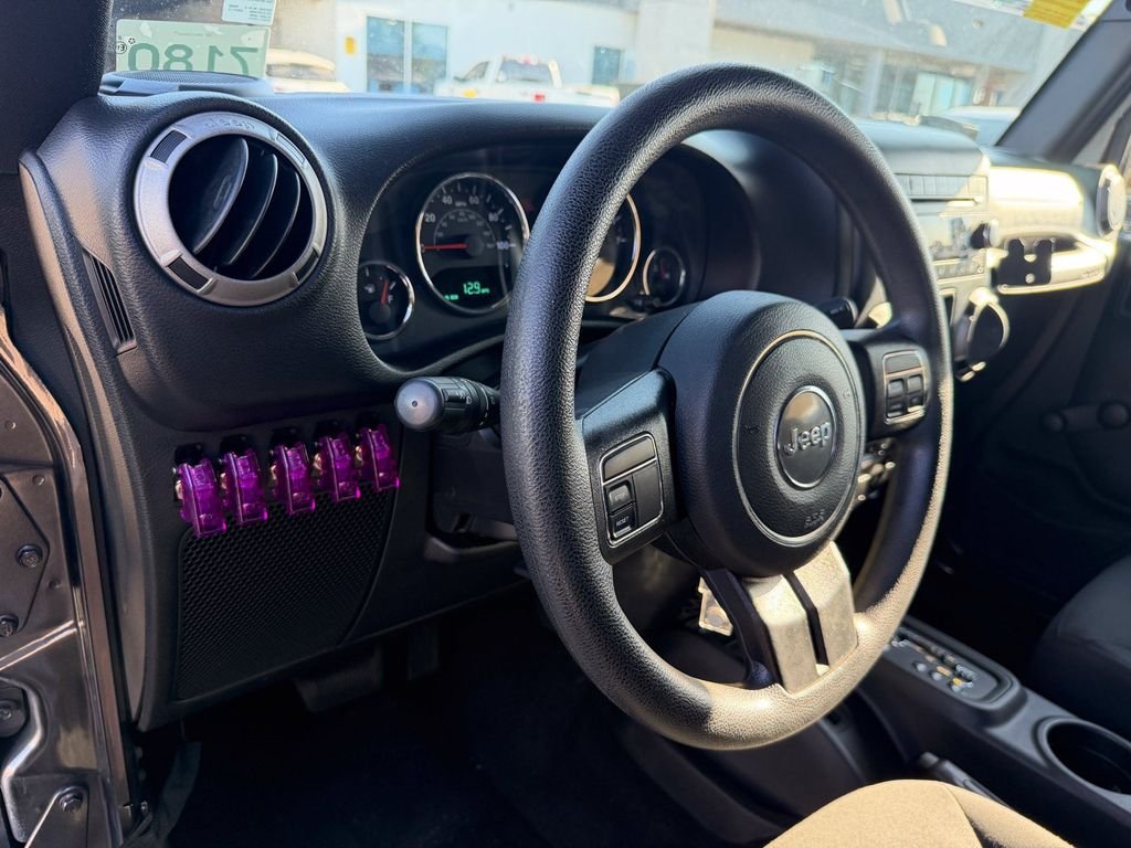 Used 2016 Granite Crystal Clearcoat Metallic Jeep Unlimited Sport image 27