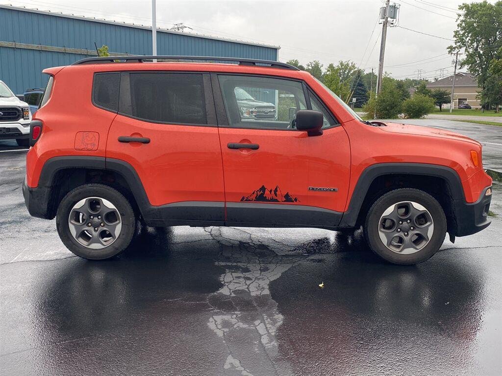 Used 2018 Omaha Orange Jeep Sport image 11