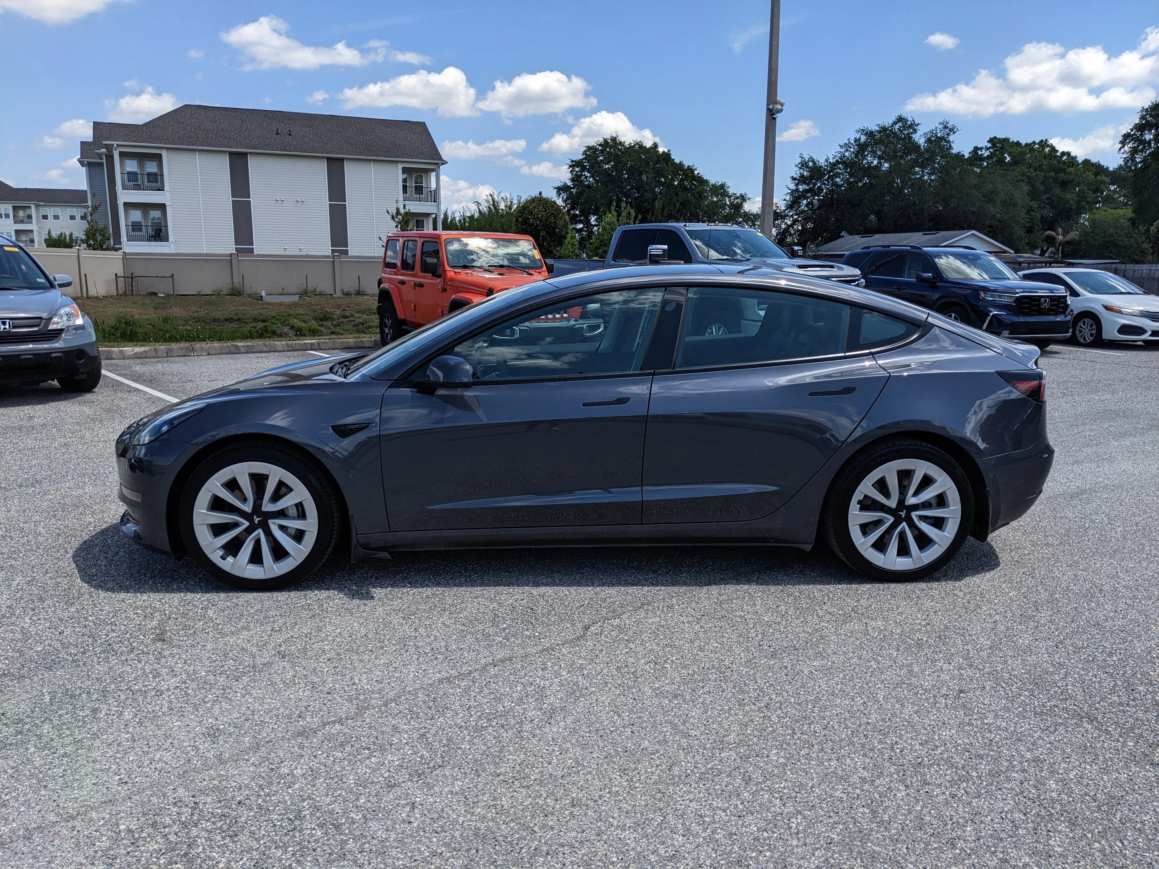 Used 2022 Tesla Model 3 Base with VIN 5YJ3E1EAXNF235097 for sale in Winter Haven, FL