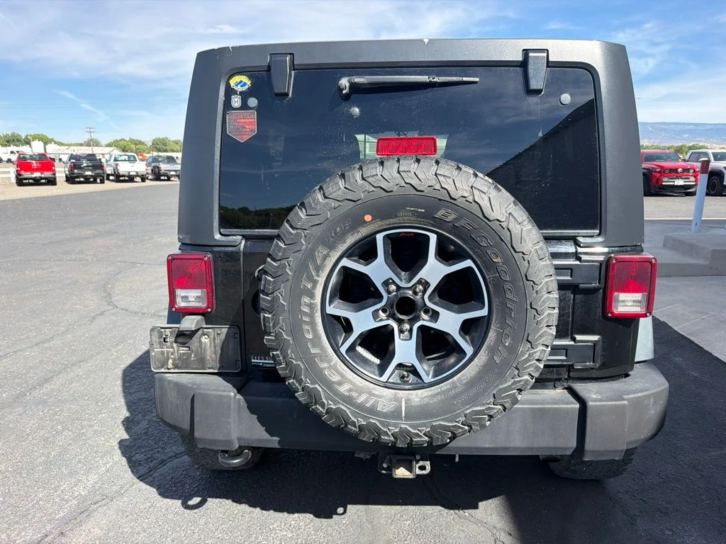 Used 2014 Black Clearcoat Jeep Unlimited Sport image 5