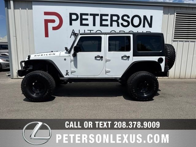 Used 2013 White Jeep Unlimited Sport image 7