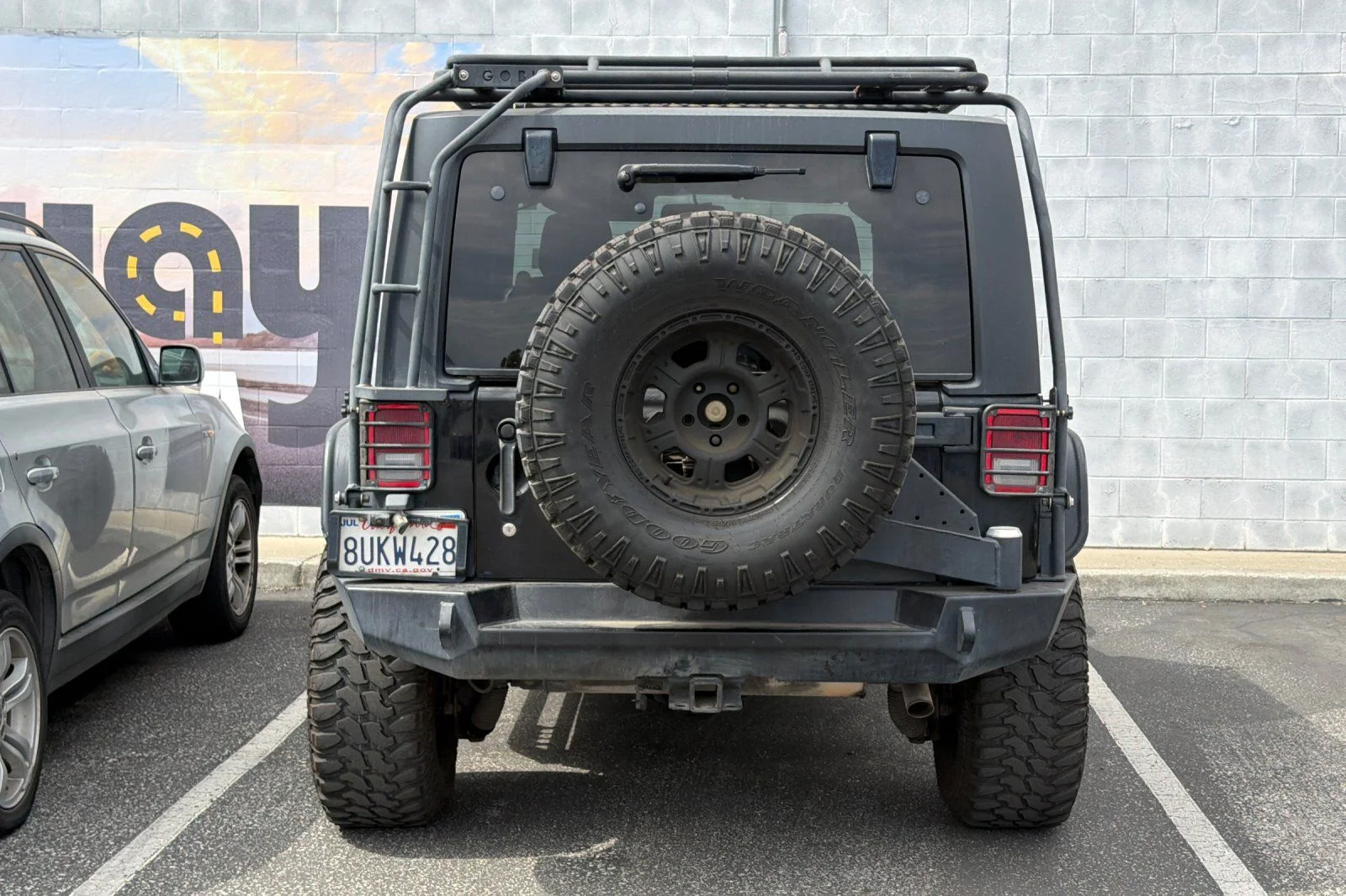Used 2013 Black Jeep Unlimited Sport image 6