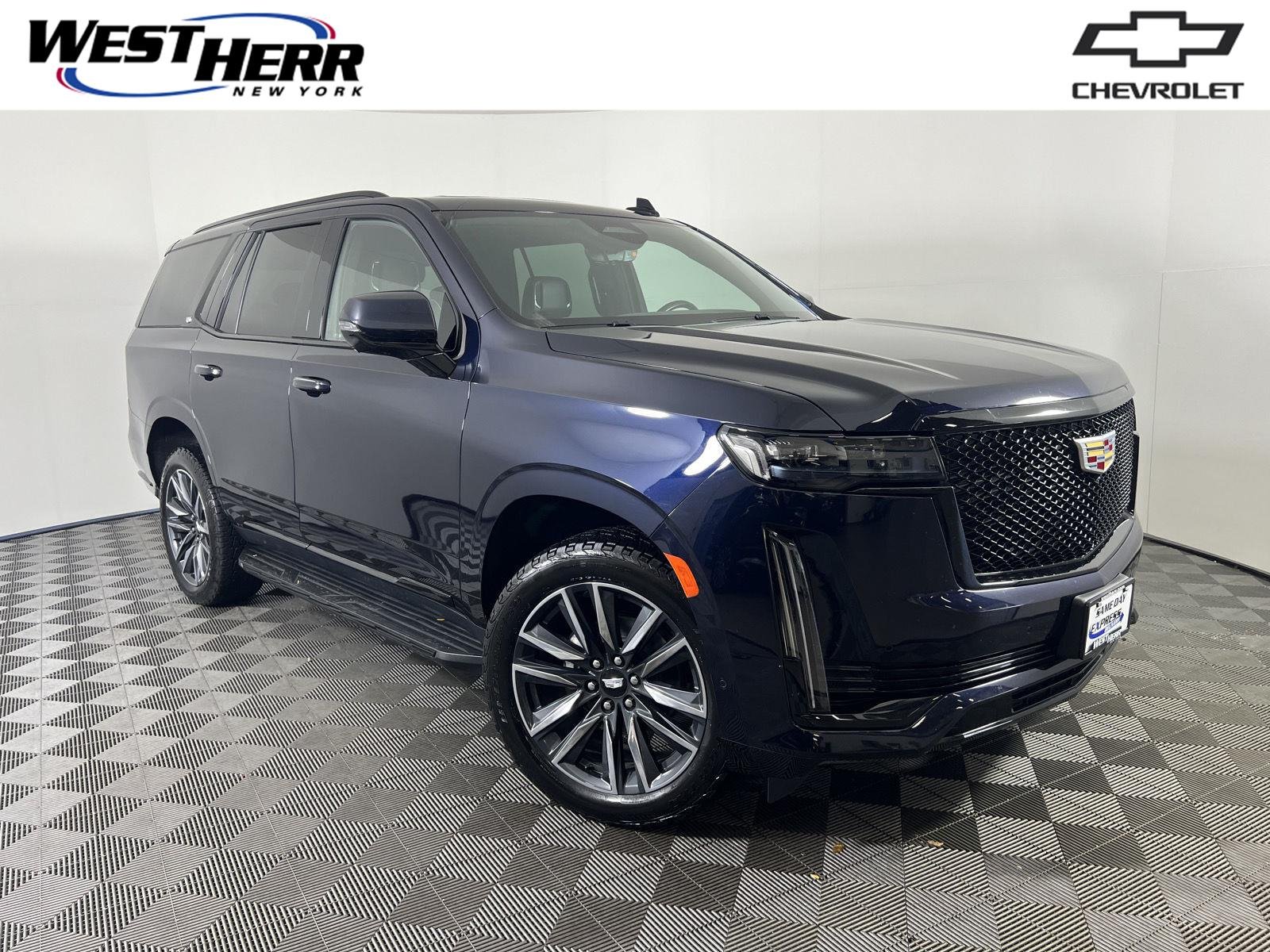 Used 2023 Dark Moon Blue Metallic Cadillac 4WD Sport image 1