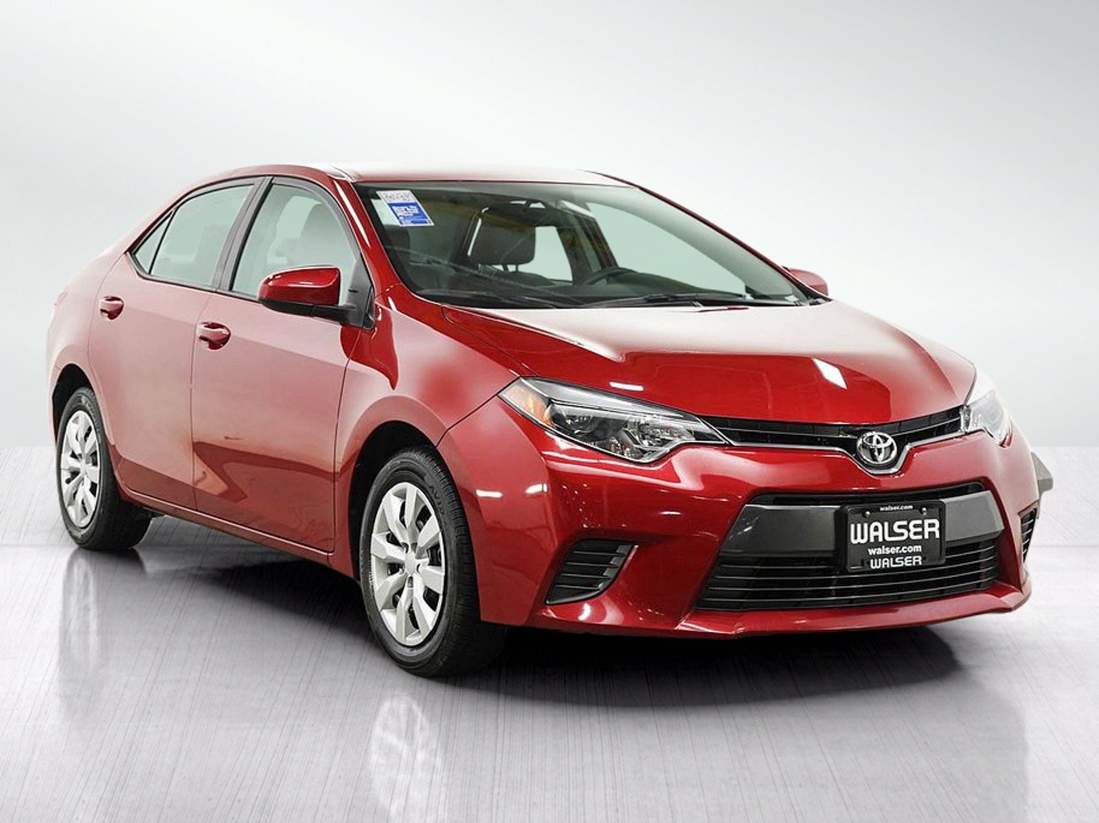 Used 2016 Barcelona Red Metallic Toyota LE image 7