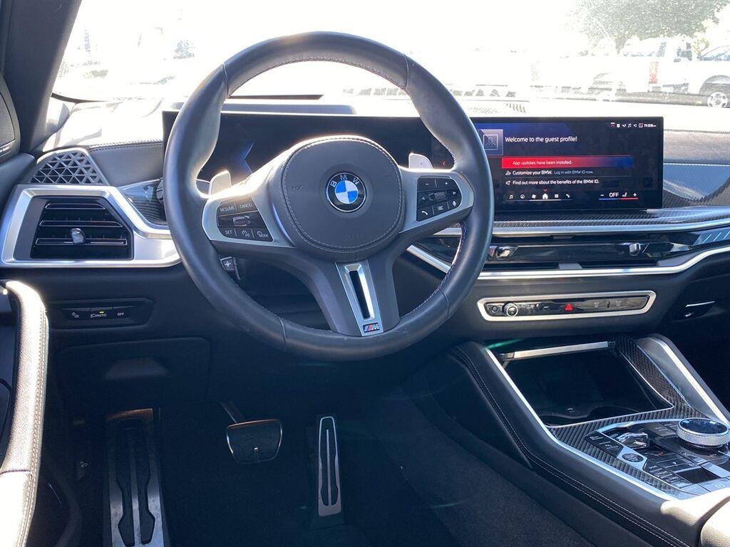 Used 2026 Black Sapphire Metallic BMW M60i image 3