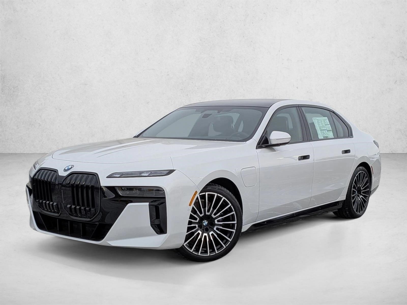 Used 2026 Mineral White Metallic BMW 750e xDrive image 1