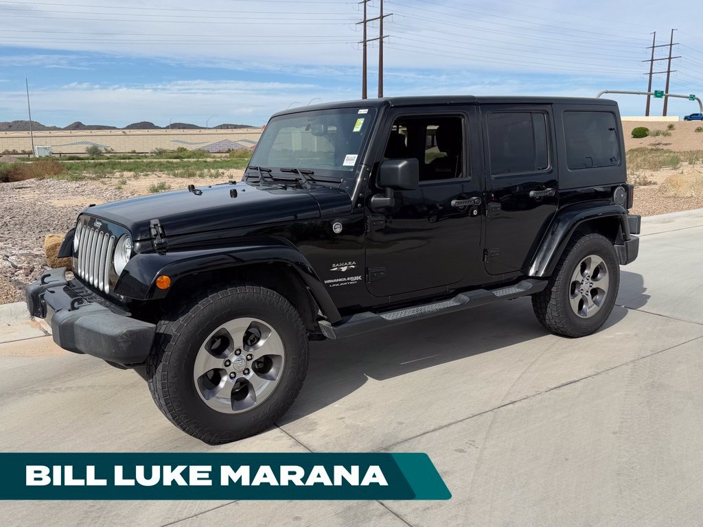 Used 2018 Black Jeep Unlimited Sahara image 1