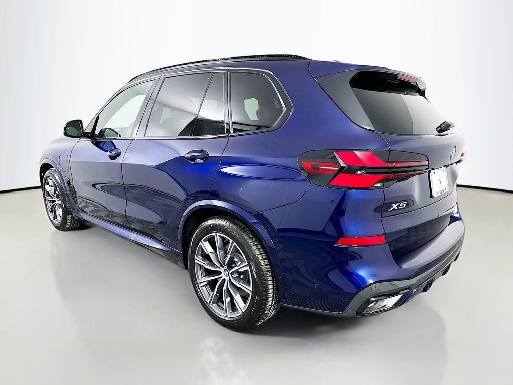 Used 2026 Tanzanite Blue II Metallic BMW xDrive50e image 7