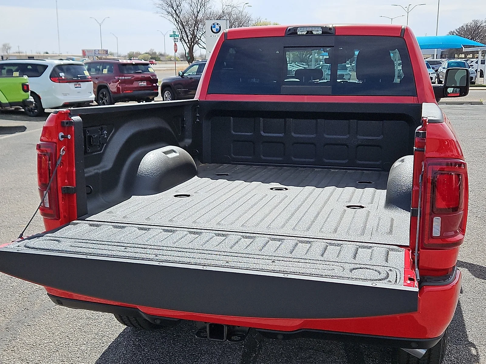 New 2026 Flame Red Ram LONE STAR CREW CAB 4X4 6