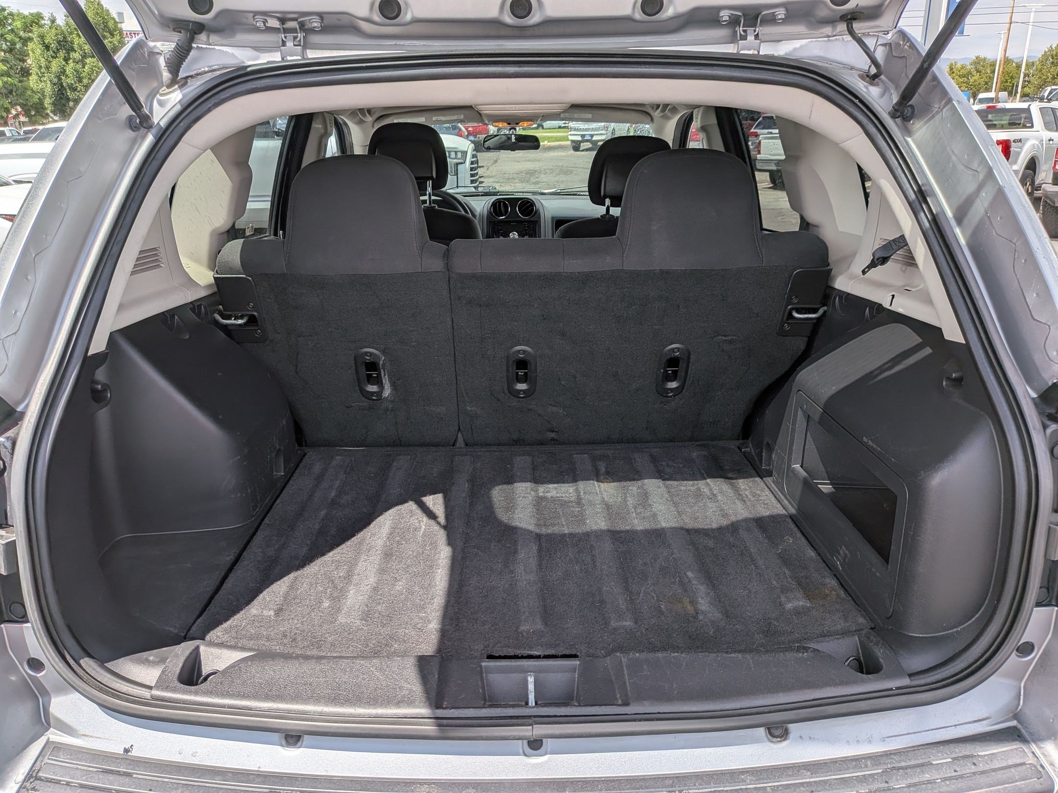 Used 2014 Billet Silver Clearcoat Metallic Jeep Sport image 26