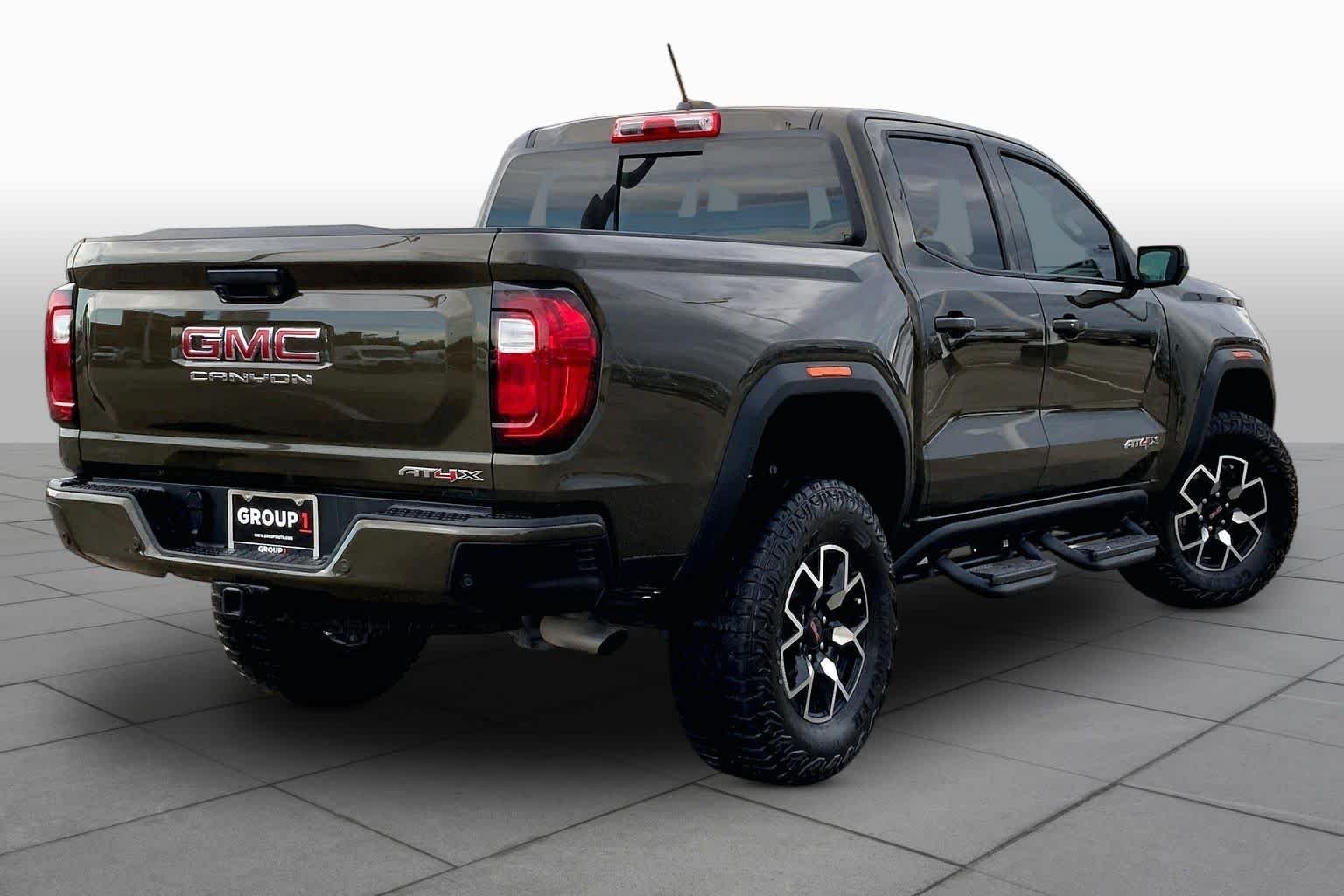 Used 2024 Deep Bronze Metallic GMC 4WD AT4X image 13