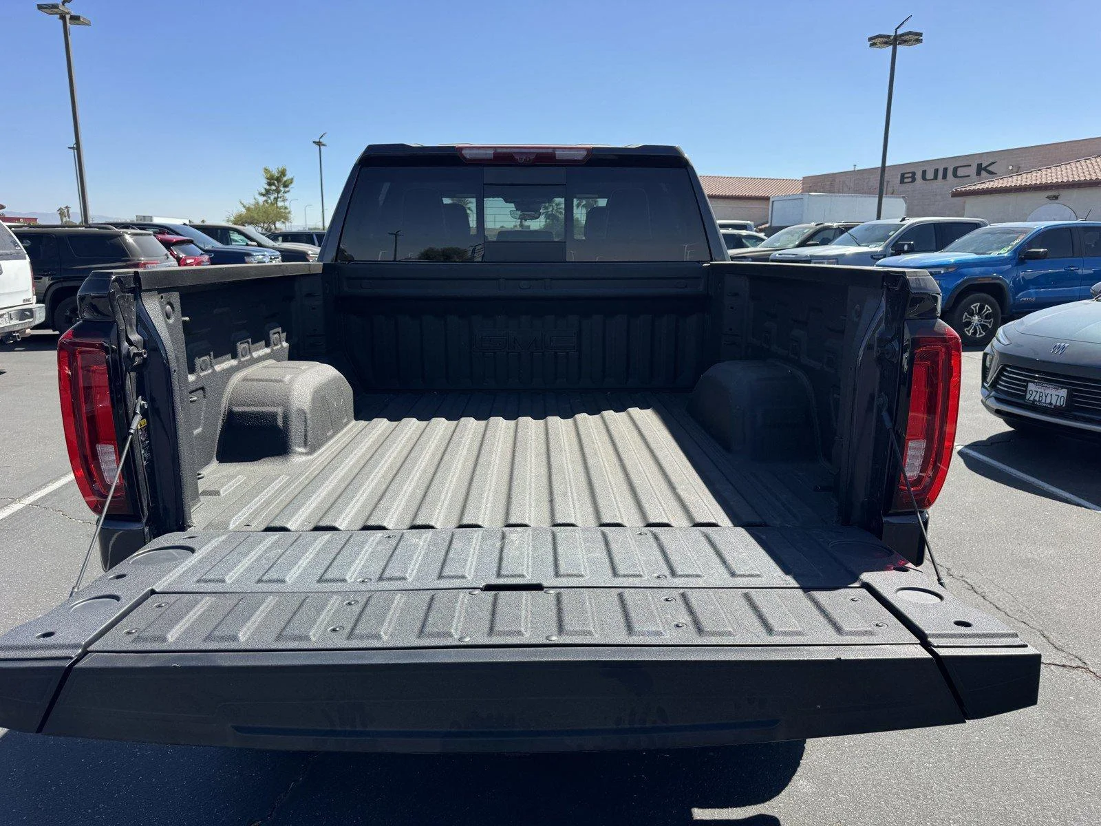 New 2026 TITANIUM RUSH METALLIC GMC AT4X image 10