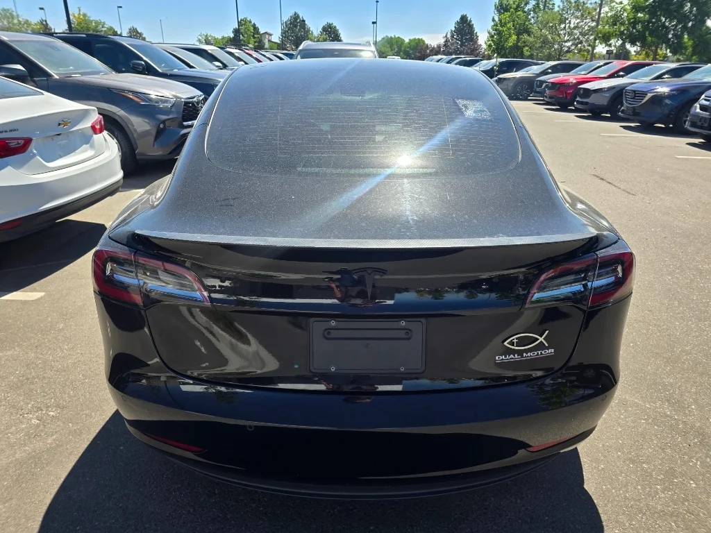 Used 2022 Solid Black Tesla Performance image 14