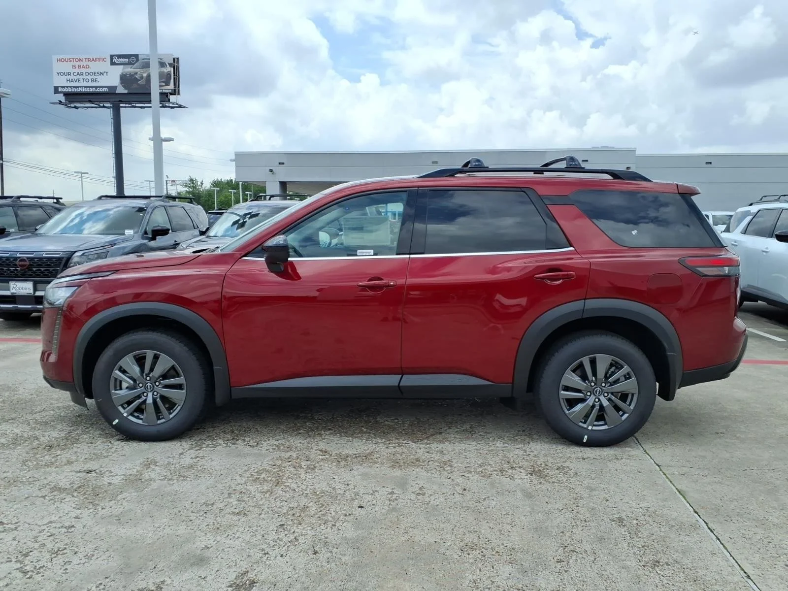 2026 Nissan Pathfinder SV Red at Robbins Nissan
