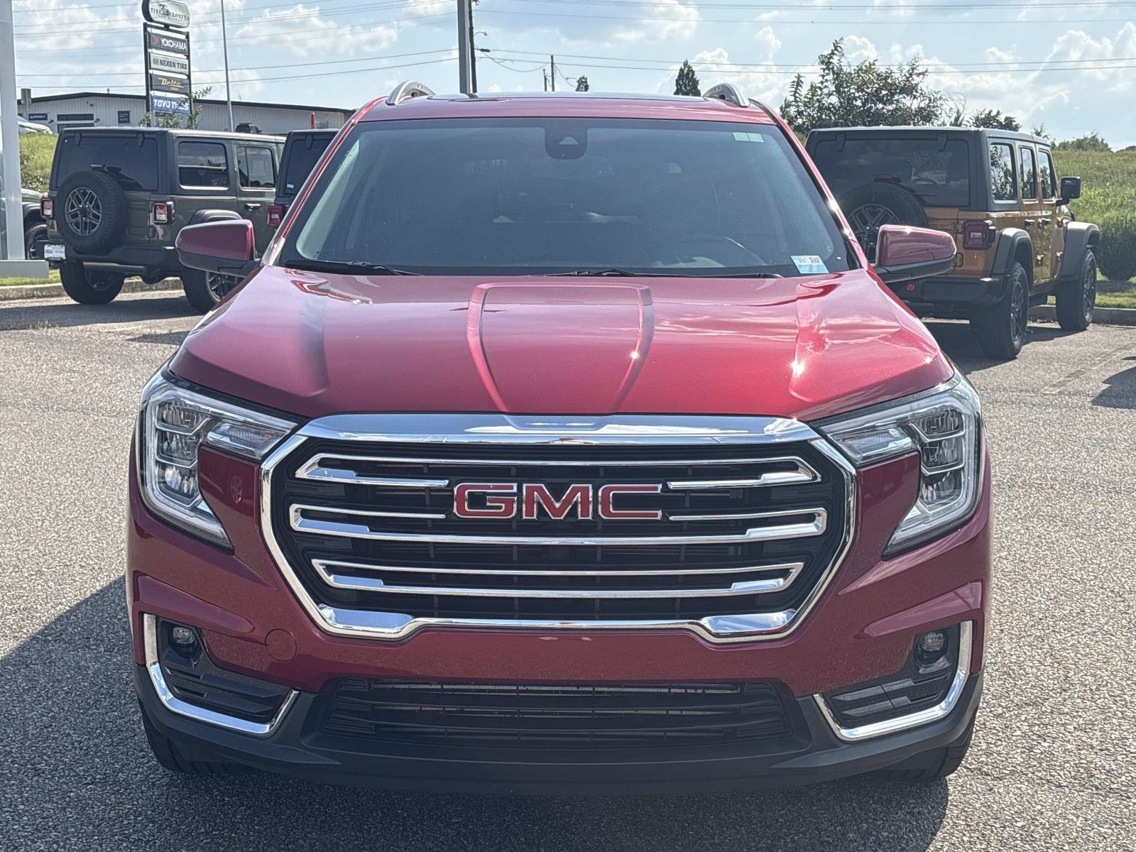 Used 2024 Volcanic Red Tintcoat GMC SLT image 2
