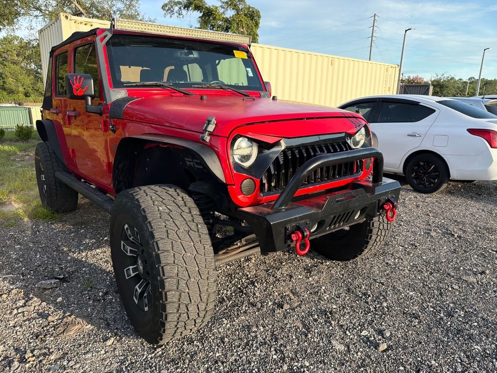 Used 2015 Red Jeep Unlimited Sport image 3