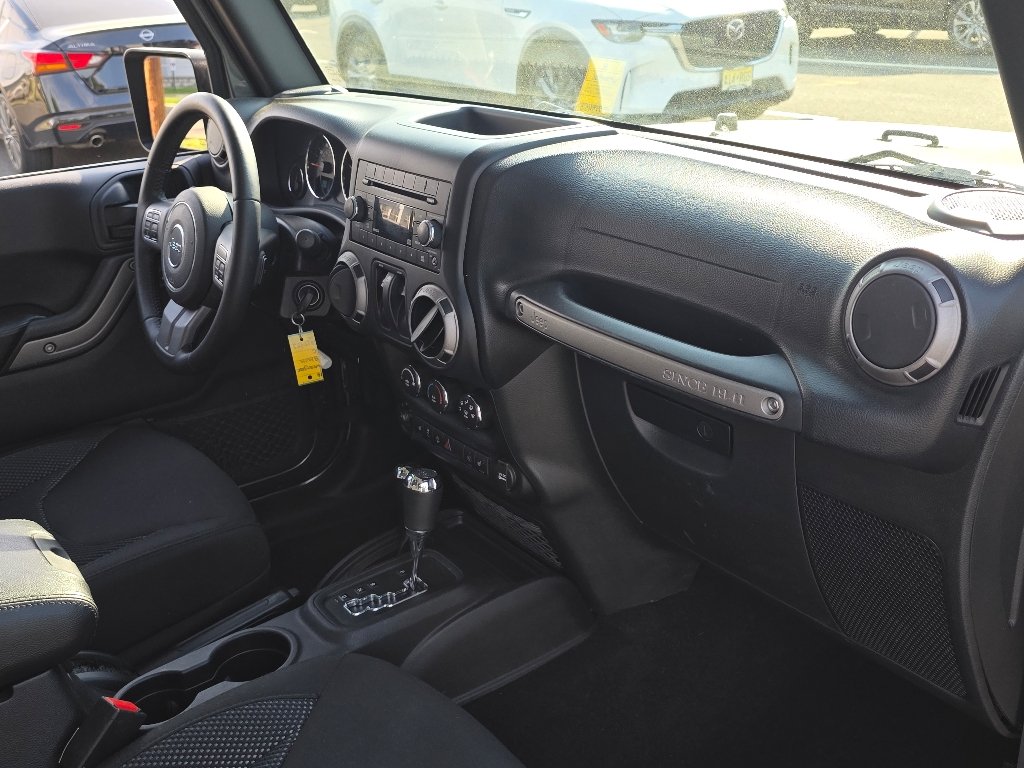 Used 2016 Granite Crystal Metallic Clear Coat Jeep Sport image 21