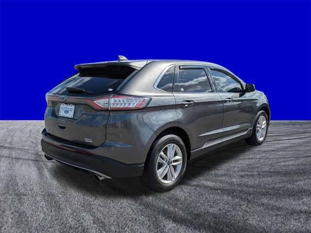 Used 2016 Magnetic Metallic Ford SEL image 4