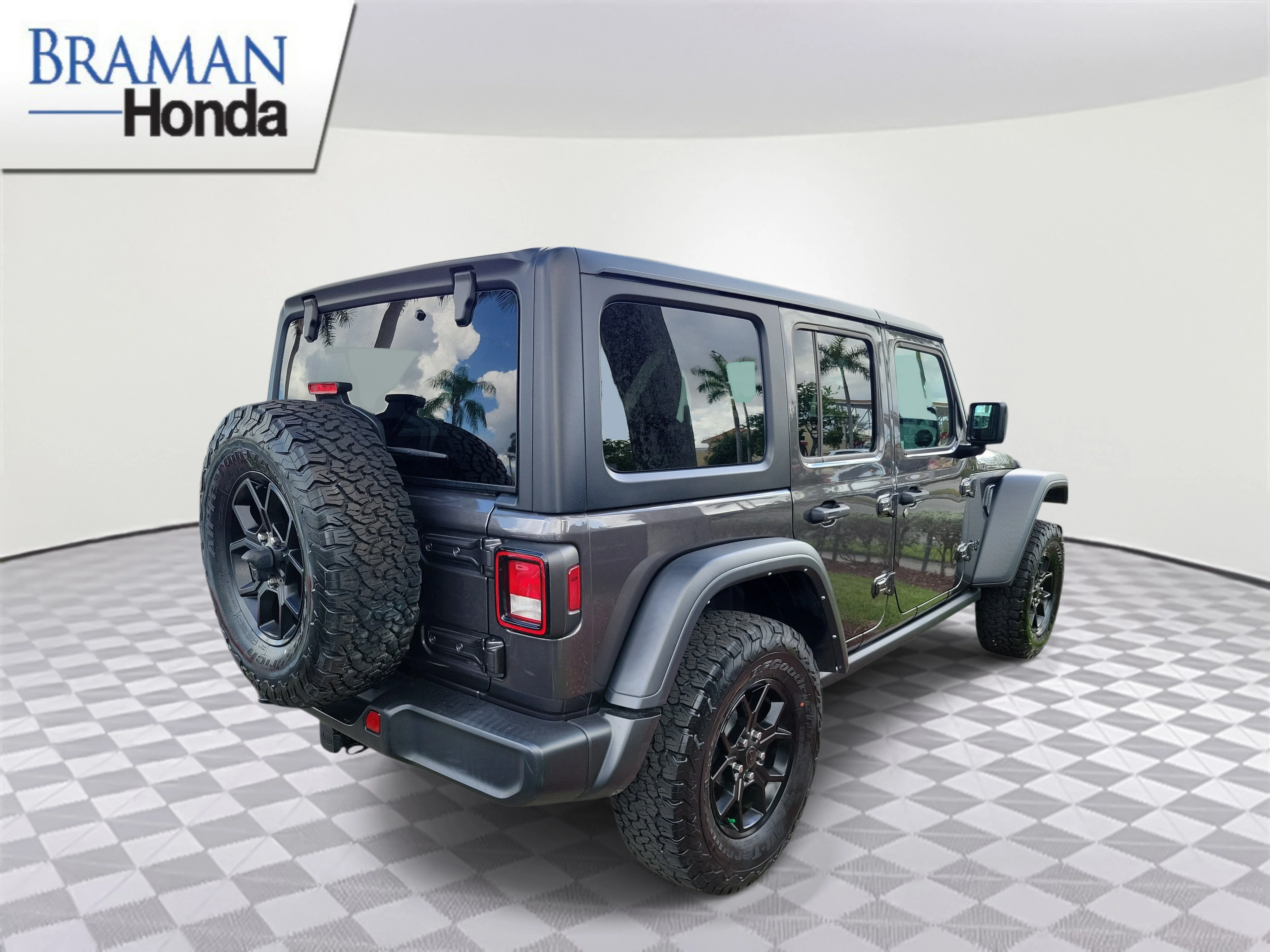 Used 2024 Granite Crystal Metallic Clearcoat Jeep Sport image 3
