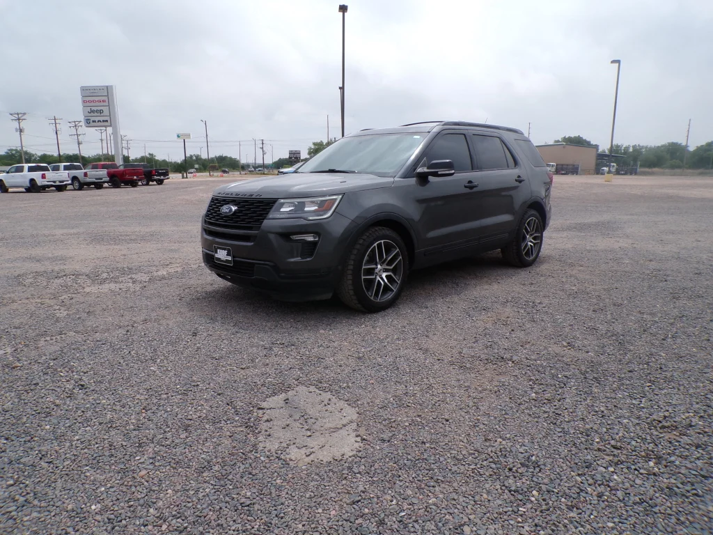 Used 2018 Magnetic Metallic Ford Sport image 1