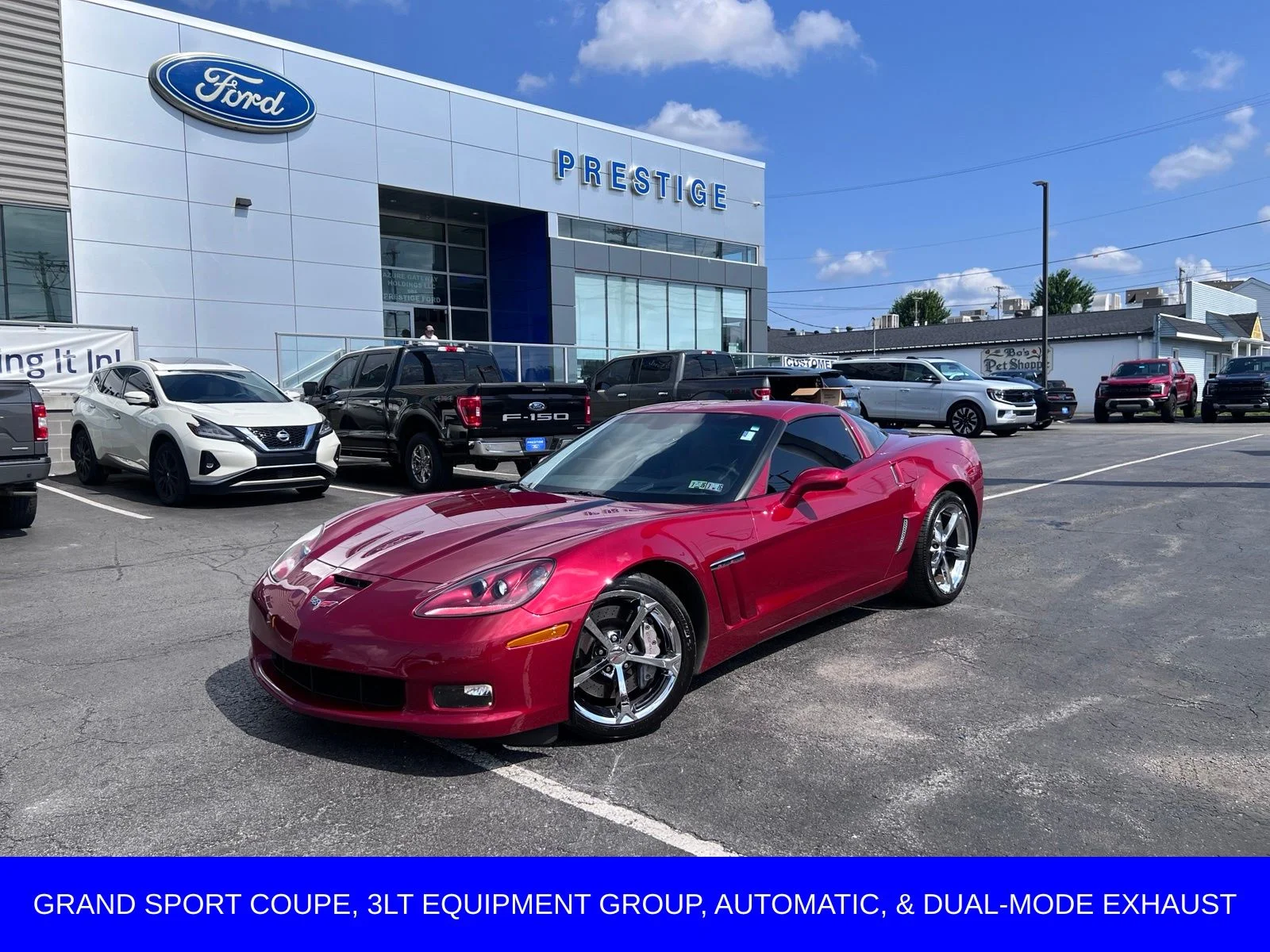 Used 2012 Crystal Red Tintcoat Chevrolet Grand Sport image 1