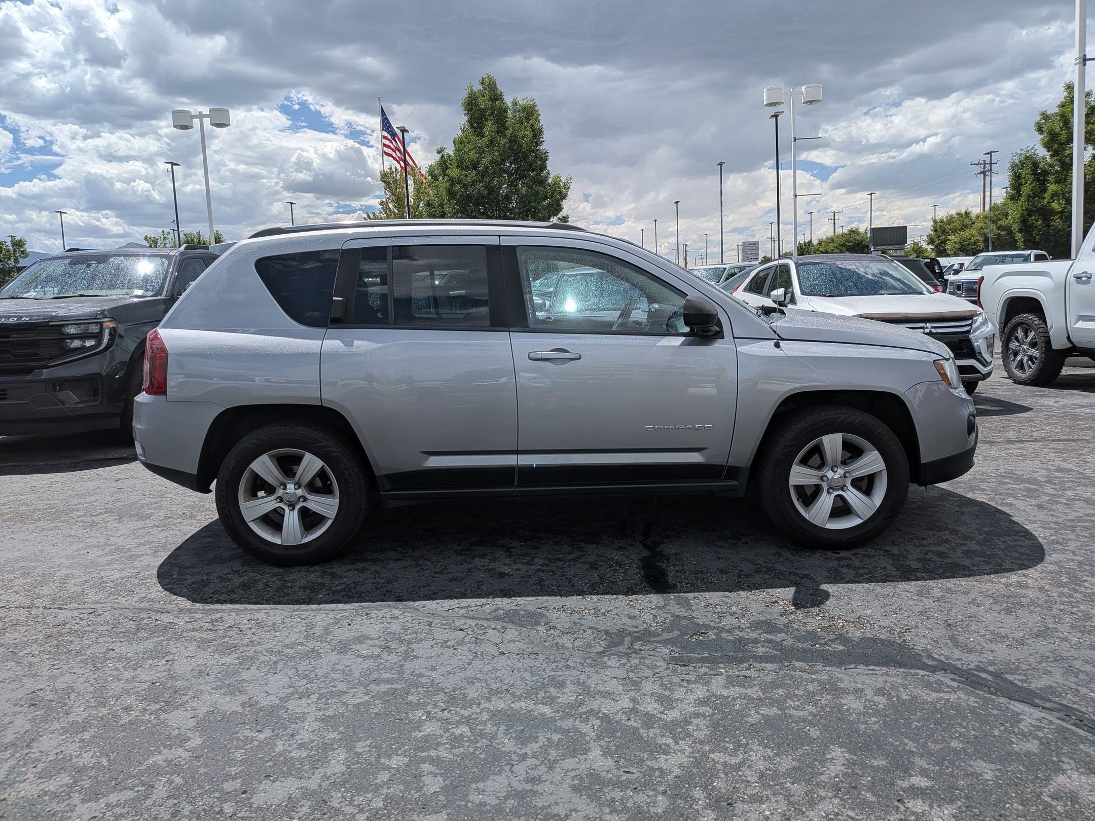 Used 2014 Billet Silver Clearcoat Metallic Jeep Sport image 2