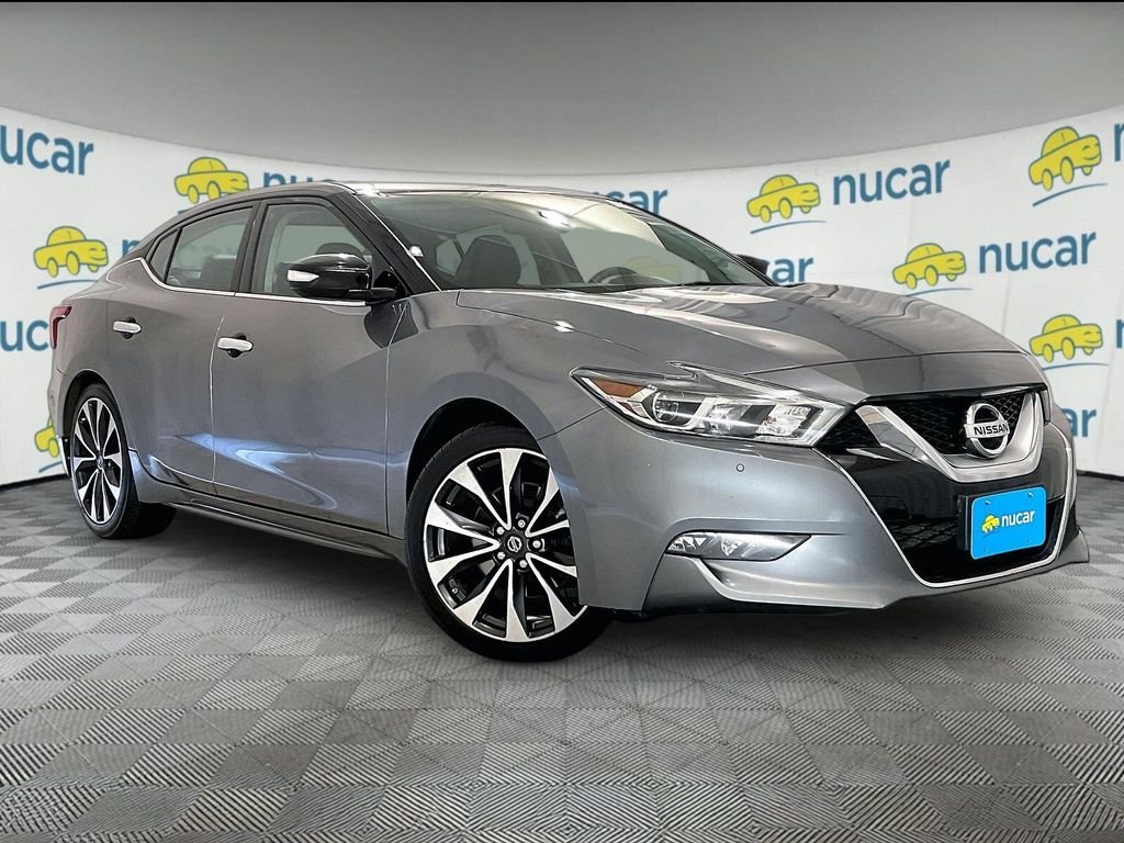 Used 2016 Gun Metallic Nissan SR image 1