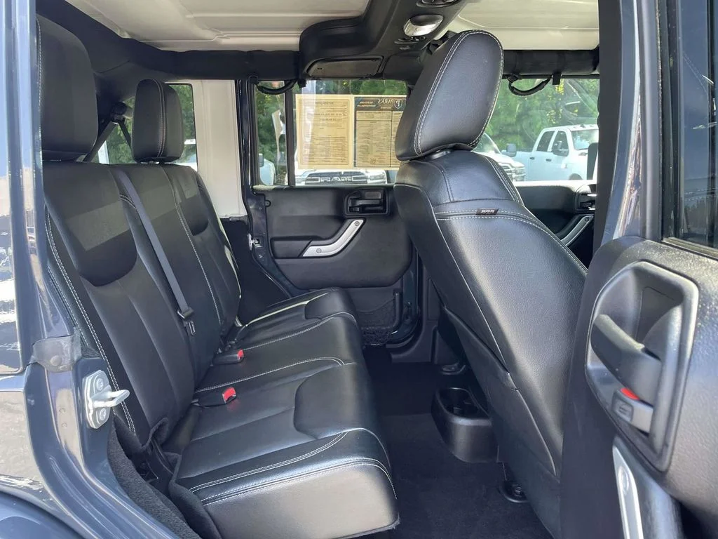 Used 2016 Black Jeep Unlimited Sahara image 17