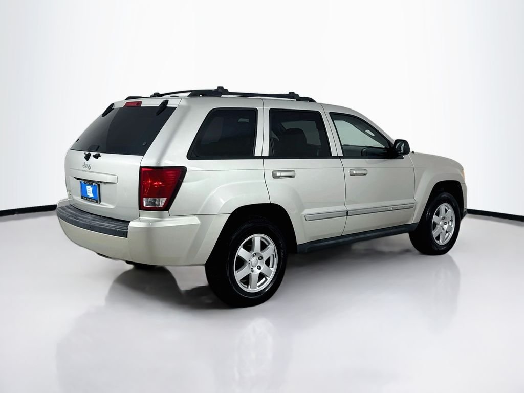 Used 2010 Light Graystone Pearlcoat Jeep Laredo image 7
