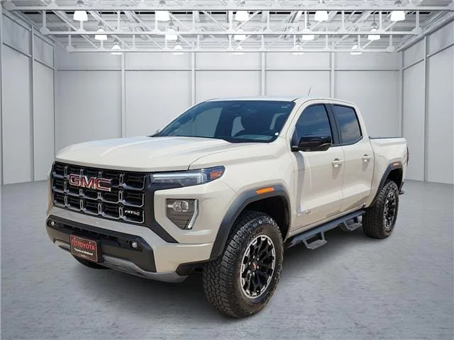 Used 2026 Tan GMC AT4 4x4 Crew Cab 5 ft. box 131 in. WB image 1