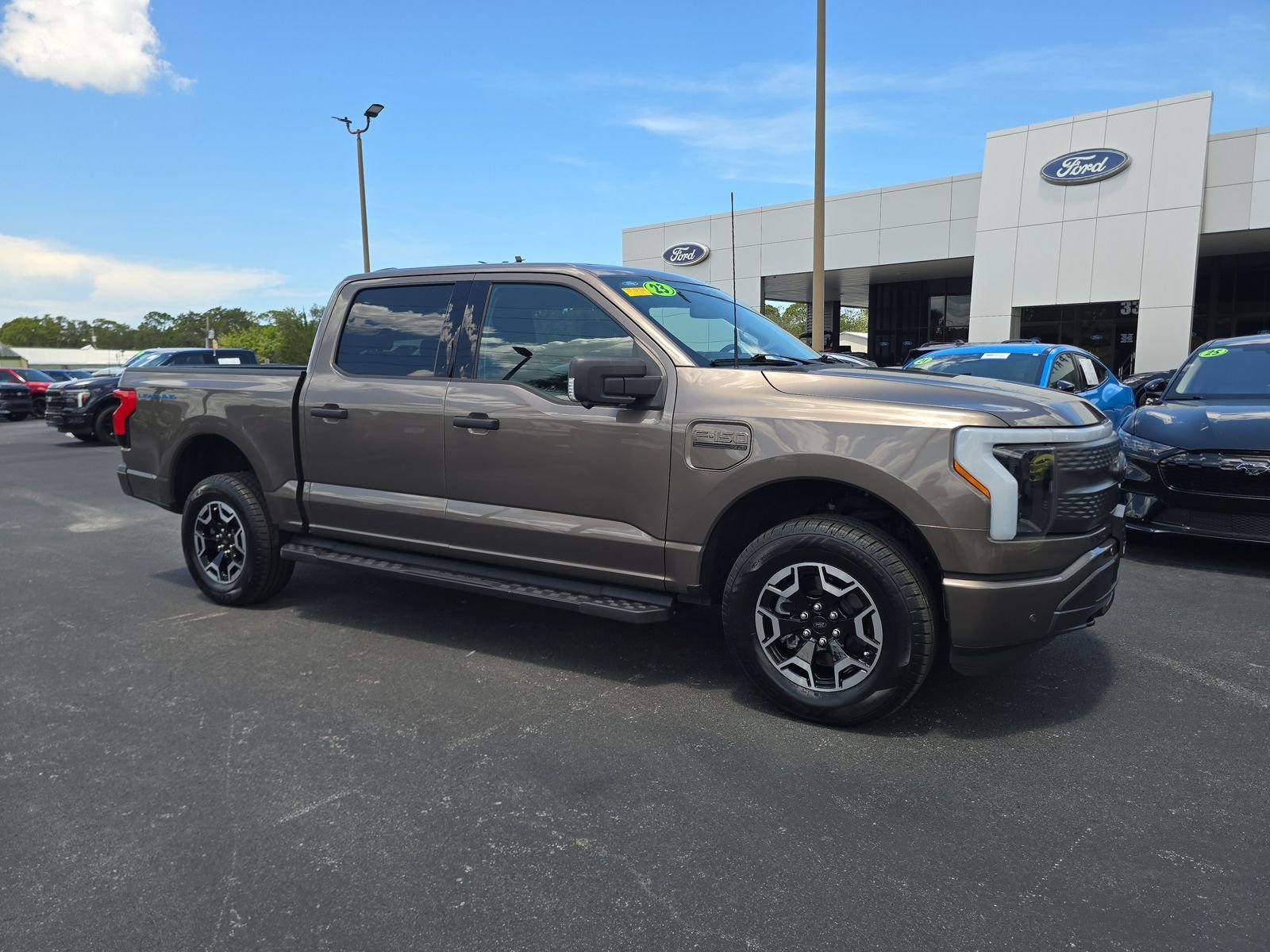 Certified 2023 Ford F-150 Lightning XLT with VIN 1FTVW1EL6PWG58751 for sale in Spring Hill, FL