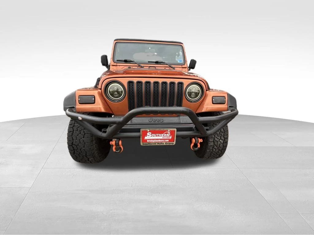 Used 2000 Orange Jeep Sport image 8