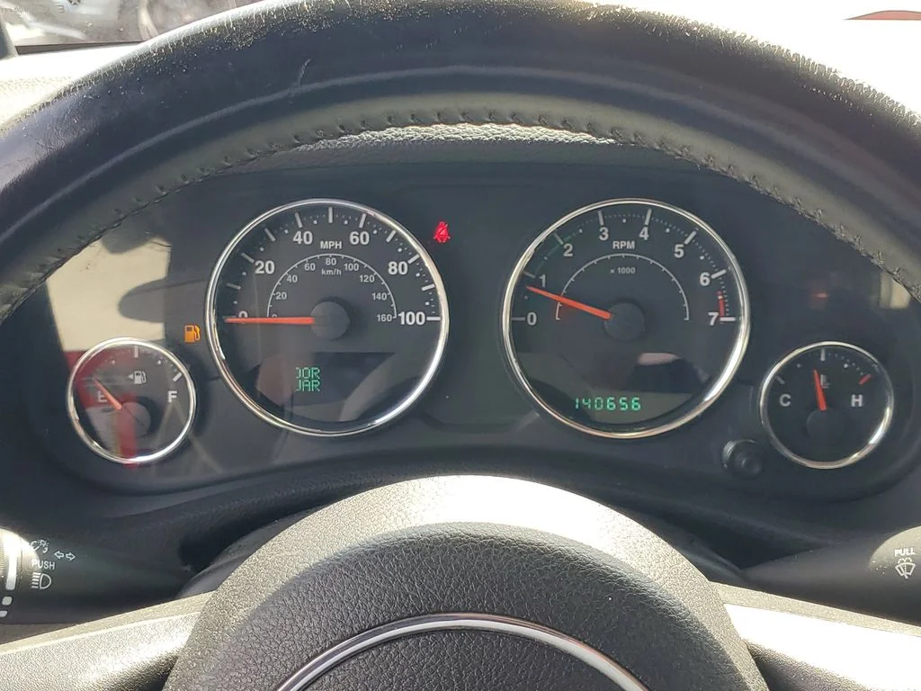 Used 2013 Red Jeep Unlimited Sport image 23