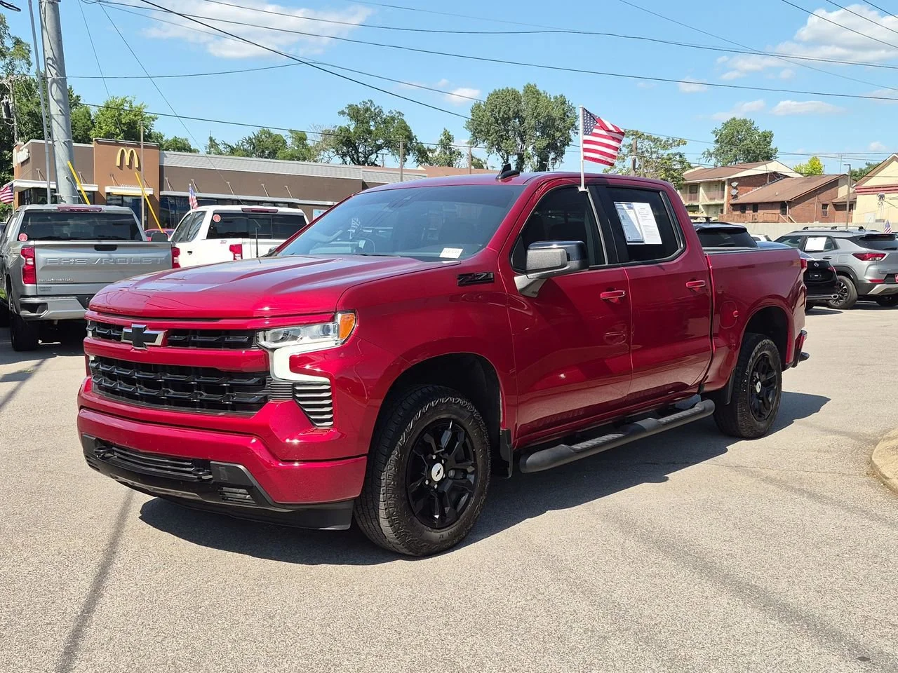 Used 2025 Radiant Red Tintcoat Chevrolet RST image 1