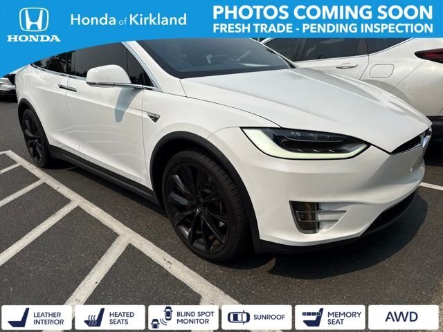 Used 2016 Solid White Tesla  image 1
