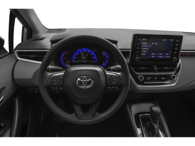 Used 2021 Super White Toyota Hybrid LE image 7