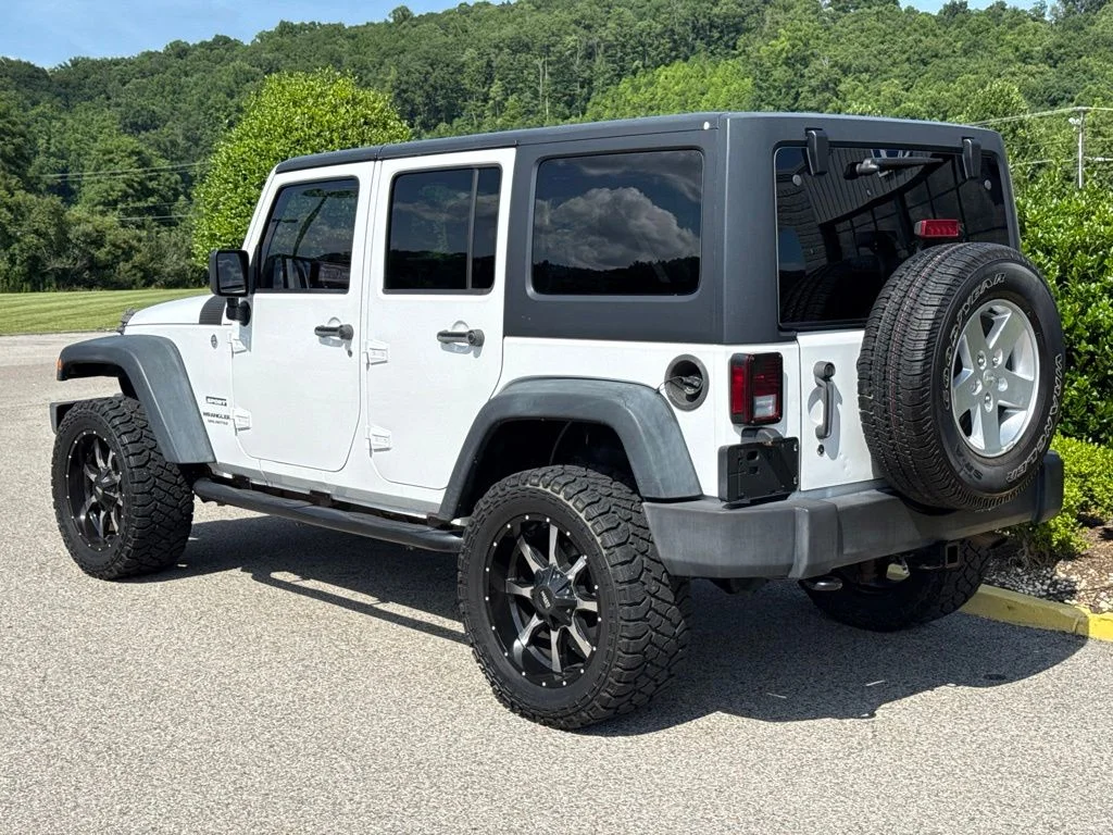 Used 2013 Bright White Jeep Unlimited Sport image 4