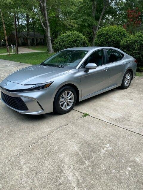 Used 2025 Celestial Silver Metallic Toyota LE image 1