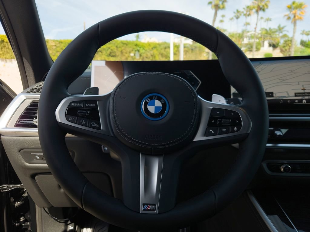 New 2026 Black Sapphire Metallic BMW xDrive50e image 14