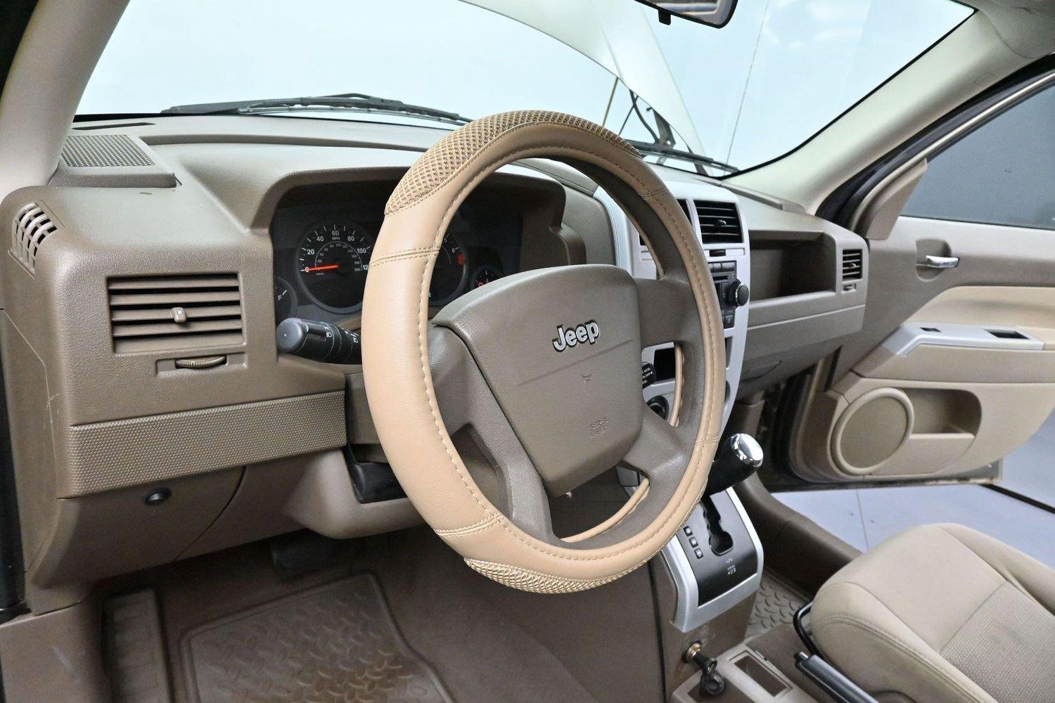 Used 2008 Light Khaki Metallic Jeep Sport image 14