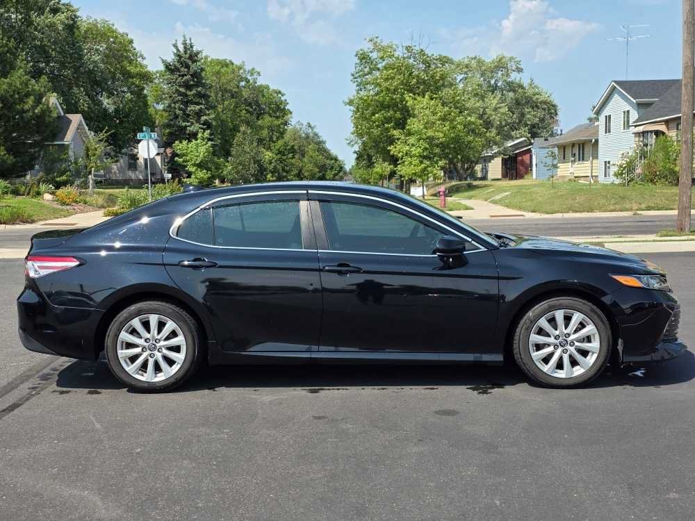 Used 2019 MIDNIGHT BLACK METALLIC Toyota LE image 1