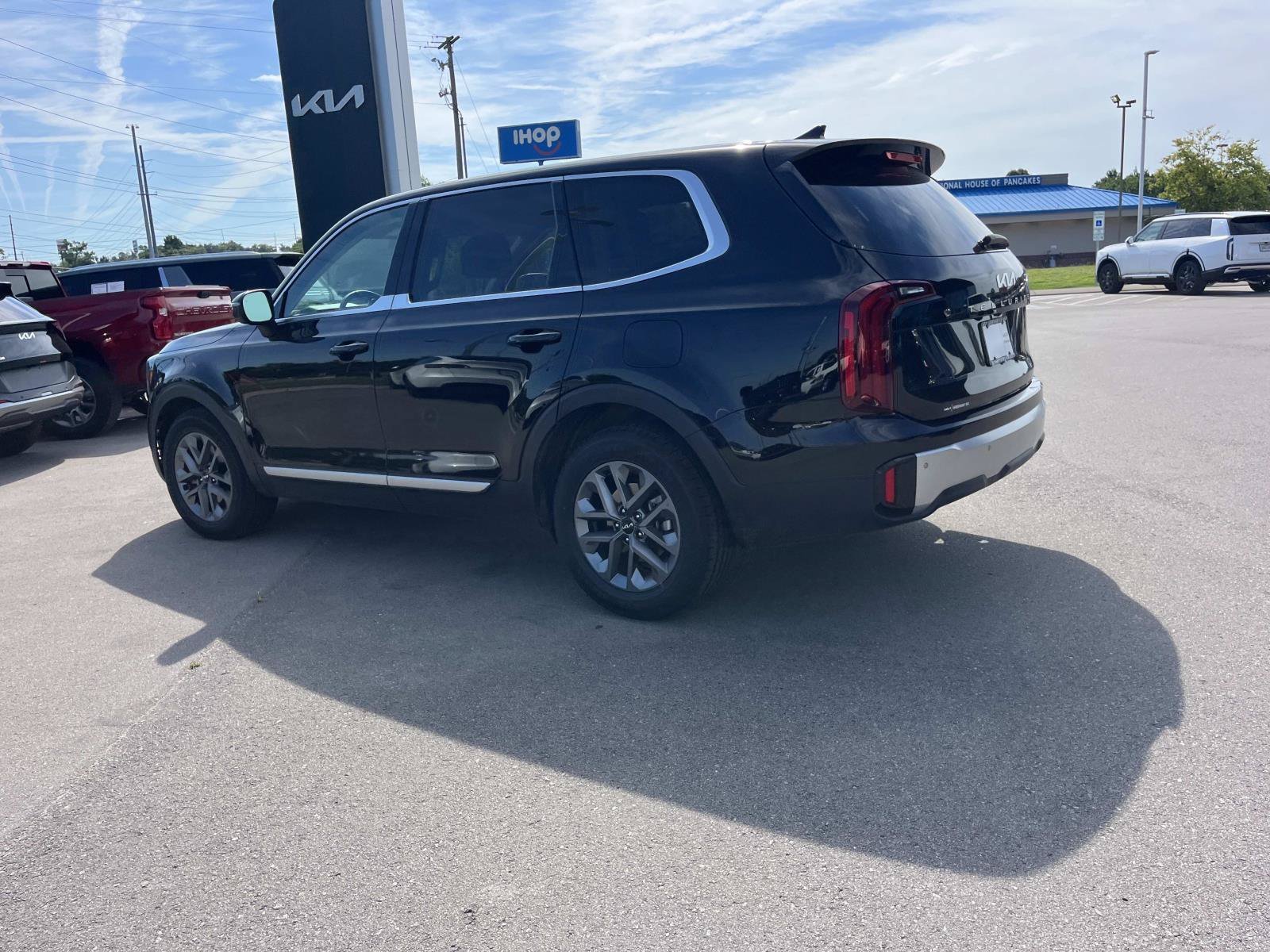 Used 2024 Ebony Black Kia LX image 6
