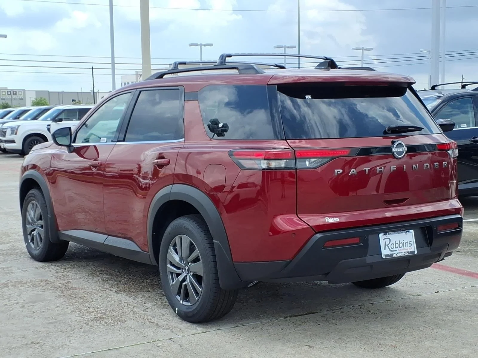 2026 Nissan Pathfinder SV Red at Robbins Nissan